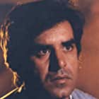 Kavi Raz در نقش Mohammad Zia Ul-Haq