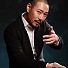 Han Qing Xing در نقش Strong stall holder