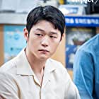 Hak-joo Lee در نقش Kim Sang-beom (2018)